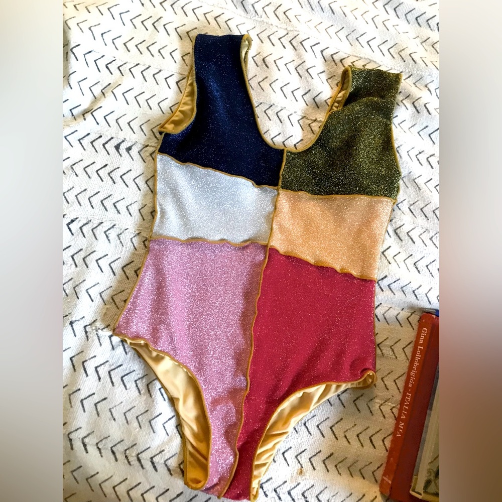 One piece gorgeous bathing suit with soft inside lining. Worn once to try on.